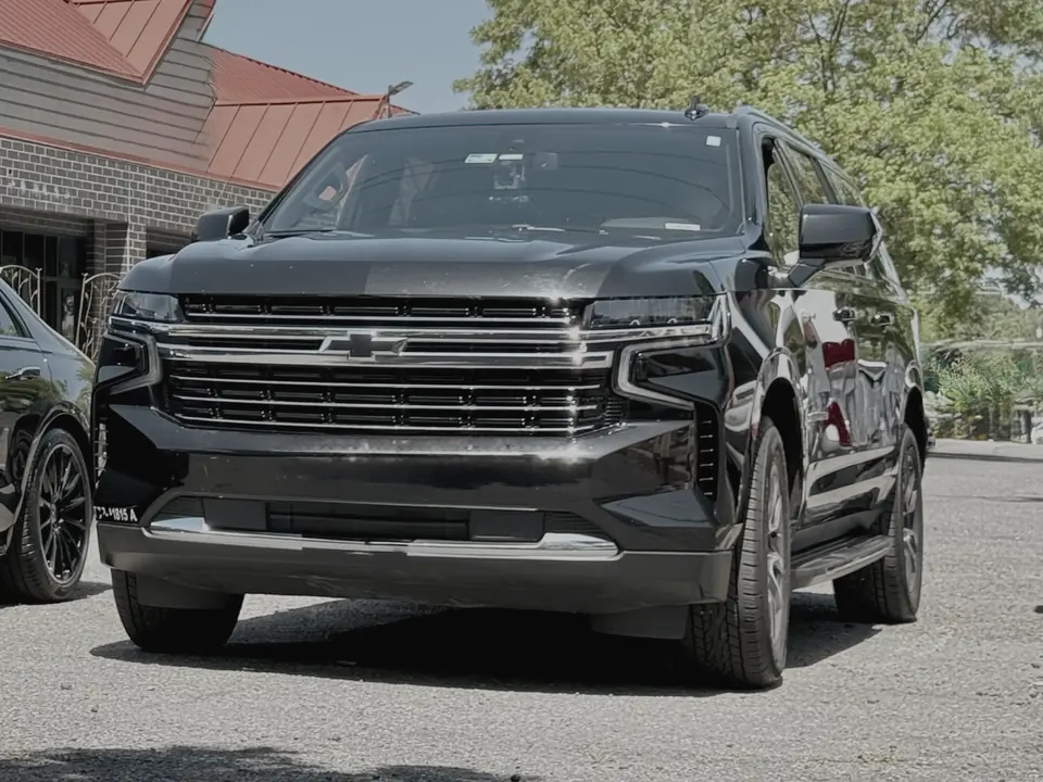 A black Chevrolet Suburban, front view