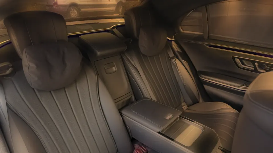 The rear seats of a Mercedes S-Class in evening light